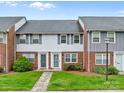 Charming brick townhome features a well-manicured lawn and inviting entrance at 1300 Larchmont Pl # 306, Salisbury, NC 28144