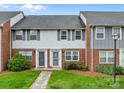 Charming brick townhome features a well-manicured lawn and inviting entrance at 1300 Larchmont Pl # 306, Salisbury, NC 28144