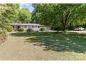 Charming single-story home with a well-maintained front yard and mature shade trees at 3332 Celanese Rd, Rock Hill, SC 29732