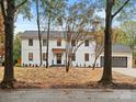 Charming two-story home with a manicured lawn, dark framed windows and black door at 3417 Chilham Pl, Charlotte, NC 28226