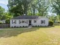 Quaint single-story home with a traditional design and lush green front lawn at 4544 Craig Ave, Charlotte, NC 28211