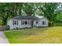 Inviting single-story home with a gray facade and a neatly landscaped front yard at 4544 Craig Ave, Charlotte, NC 28211