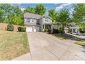 Attractive two-story home featuring a spacious driveway and meticulously maintained landscaping at 4861 Samuel Pinckney Dr, Belmont, NC 28012