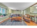 Inviting living room featuring hardwood floors, a cozy seating arrangement, and natural light from a window at 4935 Kennedy St, Hickory, NC 28602