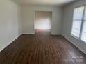 Bright living room with wood flooring and a large window at 629 Belmorrow Dr, Charlotte, NC 28214