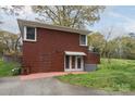 Brick home with a partially finished basement, exterior access, and small backyard at 668 Riverside Dr, Lincolnton, NC 28092