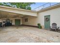 Spacious carport with ample parking, storage, and an adjacent outdoor seating area at 901 Central Dr, Kannapolis, NC 28083