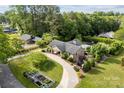An aerial view of a house with multiple garages, an outdoor patio, and a garden at 11 Secrest Ext, Belmont, NC 28012