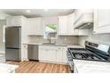 Well-equipped kitchen with stainless appliances, a gas range, and granite countertops at 112 Circle Dr, Salisbury, NC 28144