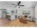 Bright living room showcases an open floor plan into the kitchen with a ceiling fan and stylish decor at 155 Jackson Rd, Salisbury, NC 28146