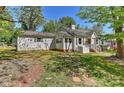 A charming one-story home with light gray siding and a well-maintained lawn at 1944 Garibaldi Ave, Charlotte, NC 28208