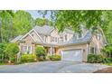 Charming two-story home with stone accents, well-manicured landscaping, and attached two car garage at 19729 Callaway Hills Ln, Davidson, NC 28036