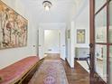 Inviting foyer featuring hardwood floors, chandelier, and elegant decor at 301 Glen Oaks Rd, Charlotte, NC 28270