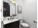 Stylish half-bathroom with a modern vanity, sleek fixtures, and a minimalist design at 3256 Brixton Ct, Charlotte, NC 28205