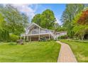 Expansive backyard with multi-level decks, manicured lawn, and lush landscaping at 376 Oak Tree Rd # 37, Mooresville, NC 28117
