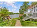 Picturesque backyard with a waterfront view, lush greenery, and a private dock at 376 Oak Tree Rd # 37, Mooresville, NC 28117