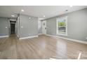 Bright and airy living room featuring sleek floors, neutral walls, and ample natural light at 500 Dedmon Dr, Charlotte, NC 28216