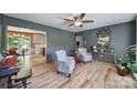 Cozy living room featuring comfortable armchairs, stylish decor, and views of the kitchen at 5938 Mundy Rd, Denver, NC 28037