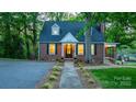 Inviting brick home showcasing a neatly landscaped front yard, classic architecture, and a welcoming entrance at 625 4Th Street Nw Dr, Hickory, NC 28601