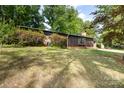 View of a single story home with wood siding and colorful landscaping at 846 Gist Rd, Rock Hill, SC 29732