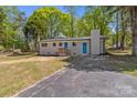 Charming single-story home with a brick chimney and a well-maintained lawn at 880 Legion Club Rd, Salisbury, NC 28146