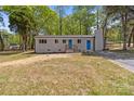 Charming single-story home with a brick chimney and a well-maintained lawn at 880 Legion Club Rd, Salisbury, NC 28146