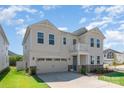 Attractive two-story home boasts manicured lawn, charming balcony, and attached two-car garage at 9102 Buckley Ct, Charlotte, NC 28269
