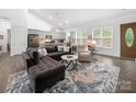 Open living space with vaulted ceiling and hardwood flooring at 11104 Pine Grove Ave, Mint Hill, NC 28227