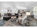 Spacious living room with vaulted ceiling next to the kitchen at 11104 Pine Grove Ave, Mint Hill, NC 28227