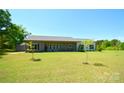 Well-maintained home featuring expansive green lawn with side views at 129 Devon Dr, Heath Springs, SC 29058