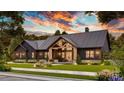 Stunning modern farmhouse-style home with beautiful landscaping and a covered porch at 181 Asbury Cir, Mooresville, NC 28117