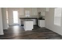 New kitchen features white cabinets, granite countertops and stainless steel appliances at 148 Kodak Dr, Statesville, NC 28625