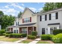 Well-manicured front lawn and traditional townhouse exterior at 1766 Forest Side Ln, Charlotte, NC 28213