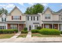 Charming townhome with symmetrical facade and green landscaping at 1766 Forest Side Ln, Charlotte, NC 28213