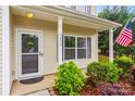 Charming front porch with decorative wreath, plants, and American flag displayed at 2624 St Helena Ct, Fort Mill, SC 29715