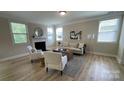 Inviting living room features large windows, a fireplace, and stylish decor at 3030 Collin House Dr, Fort Mill, SC 29715