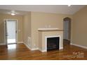 Cozy living room features hardwood floors, a fireplace, and neutral paint, creating a warm ambiance at 4193 He Propst Rd, Maiden, NC 28650