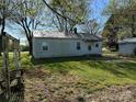 Side view of cozy cottage with a metal roof, and a storage shed is visible at 5364 Millersville Rd, Taylorsville, NC 28681