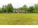 Beautiful home with a spacious front yard, mature trees, and a welcoming front porch at 5840 Shirley Rd, Fort Lawn, SC 29714