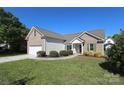 Inviting exterior showcasing well-manicured lawn and brick accents at 1002 Christobal Ct, Indian Trail, NC 28079