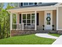 Charming front porch with decorative wreath and manicured lawn at 1112 Allman Ext, Mount Pleasant, NC 28124