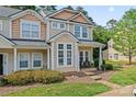 Inviting townhome with a quaint front porch, perfect for relaxing outdoors at 1161 Constitution Park Blvd, Rock Hill, SC 29732