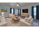 Bright living room with neutral walls, modern furnishings, and plenty of natural light at 1210 Longwall Ln, Matthews, NC 28104