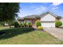 Attractive brick home with pristine landscaping, featuring a lush lawn and well-maintained front facade on a sunny day at 123 Shoreview Dr, Mooresville, NC 28117