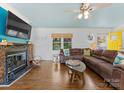 Cozy living room with stone fireplace and large comfortable sofa at 1430 Mollys Backbone Rd, Catawba, NC 28609
