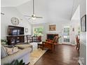 Inviting living room with vaulted ceiling, fireplace, comfortable seating, and ample natural light at 1506 Crestdale Rd, Rock Hill, SC 29732