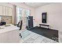 Bright office space with a treadmill, desk area, and natural light at 16219 Long Talon Way, Charlotte, NC 28273