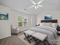 Cozy bedroom with a large window, soft carpet, and a ceiling fan at 1762 Tate Rd, Rock Hill, SC 29732