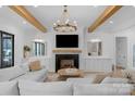 Elegant living room with coffered ceiling, built-in cabinets, fireplace, and ample natural light at 2165 Country Club Rd, Lincolnton, NC 28092