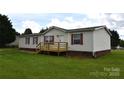 Well-kept home showcasing its front exterior with neat landscaping and cozy porch at 234 Olin Loop, Olin, NC 28660